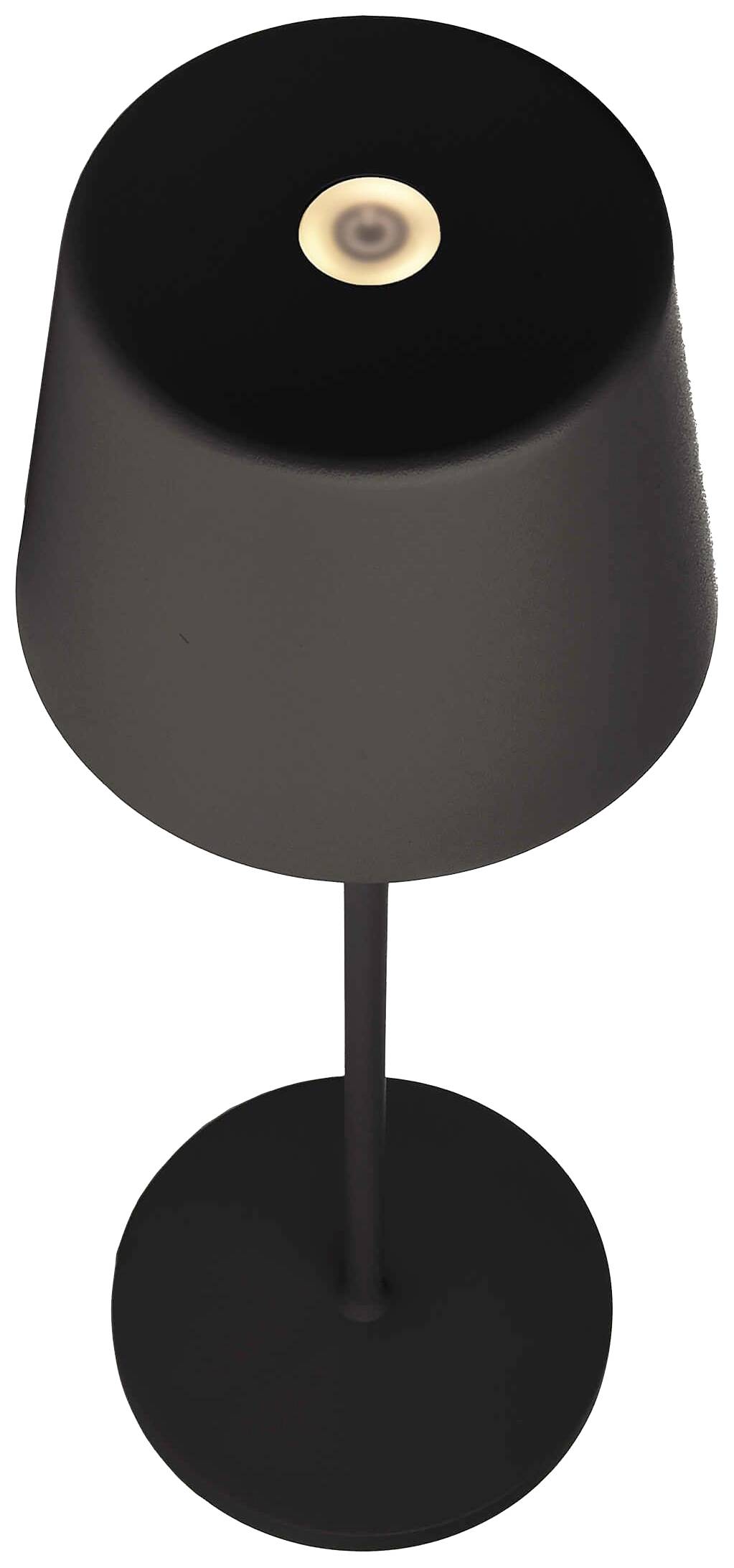 Schwarze, moderne Tischlampe mit dünnem Stiel und kreisförmigem Sockel. Ein kleiner Lichtkreis leuchtet oben auf dem Lampenschirm.