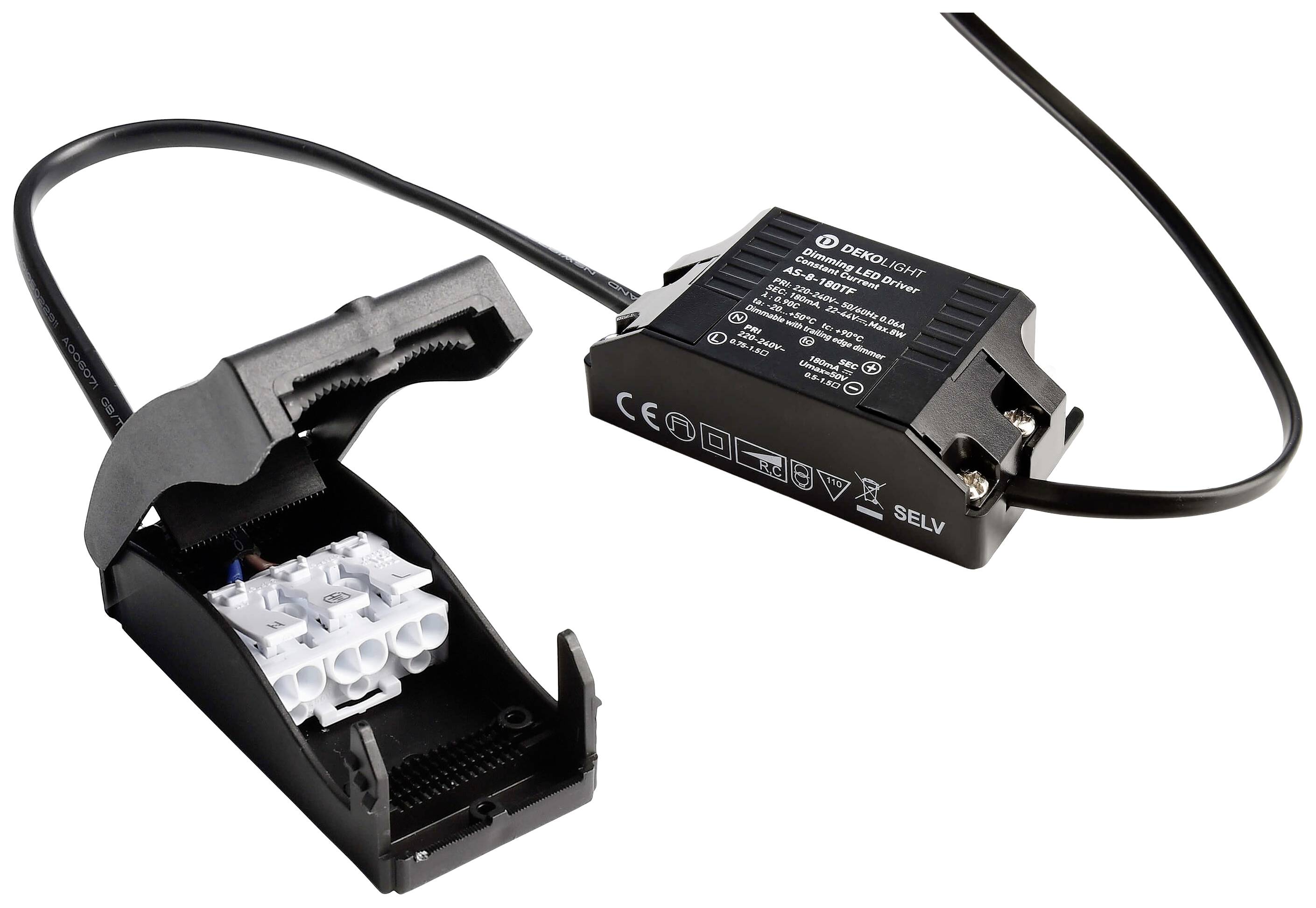 Ein schwarzes elektronisches Gerät mit einem Kabel, das mit einem offenen Kunststoffgehäuse verbunden ist, das weiße Anschlussklemmen zeigt.