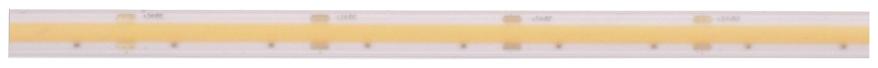 Ein hellorangefarbener Plastiklineal mit metrischen Skalen in Zentimeter und Millimeter, zeigt viele Markierungen.