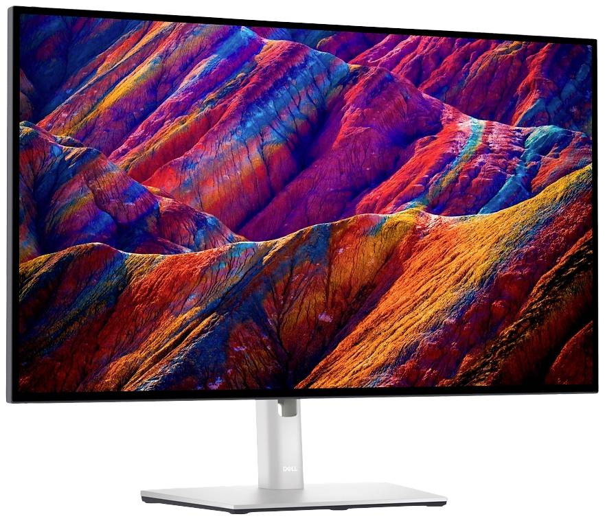 Ein Computer-Monitor zeigt ein farbenfrohes, abstraktes Bild, das an bunte Gebirgslandschaften erinnert.