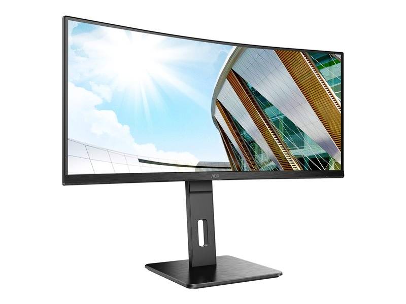 Ein gebogener Computermonitor zeigt ein Foto von einem modernen Gebäude unter einem blauen Himmel mit Sonne.