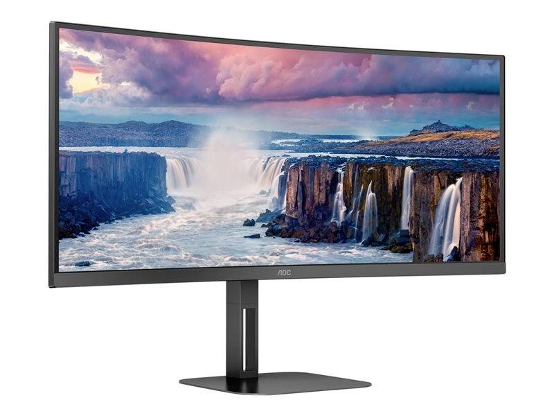 Ein ultrabreiter Monitor zeigt eine atemberaubende Landschaft mit Wasserfällen unter einem dramatisch gefärbten Himmel.