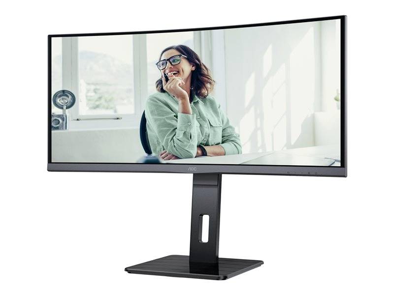 Ein gebogener Computerbildschirm mit dem Bild einer lächelnden Frau im Büro. Sie trägt eine Brille und ein grünes Hemd.