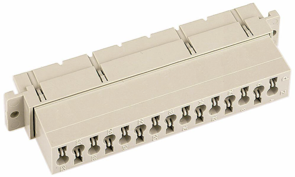 Ein elfenbeinfarbener Mehrfachanschlussblock mit mehreren Klemmen für elektrische oder telekommunikative Verbindungen.