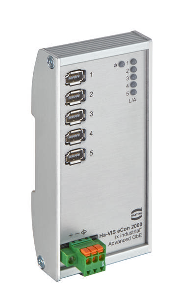 Ein silberner Ethernet-Switch mit fünf USB-Ports, beschriftet mit Zahlen 1-5 und einem L/A-Indikator. Unten ist ein grüner Stromanschluss.