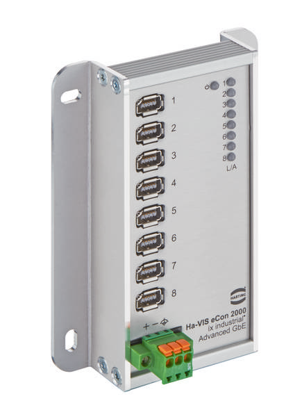 Ein silberner Netzwerk-Switch mit acht USB-Ports und LED-Anzeigen zur Verbindung und Aktivität, geeignet für industrielle Anwendungen.