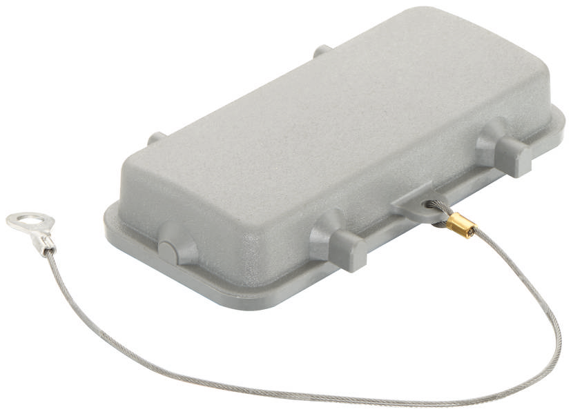 Graues rechteckiges Gehäuse mit abgerundeten Ecken und Metallschlaufe. Bestandteil eines größeren elektronischen Systems.