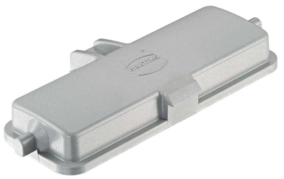 Metallische Gehäuseabdeckung in rechteckiger Form, seitlich zwei Befestigungselemente. Oberfläche glatt, Name 'Harting' eingraviert.