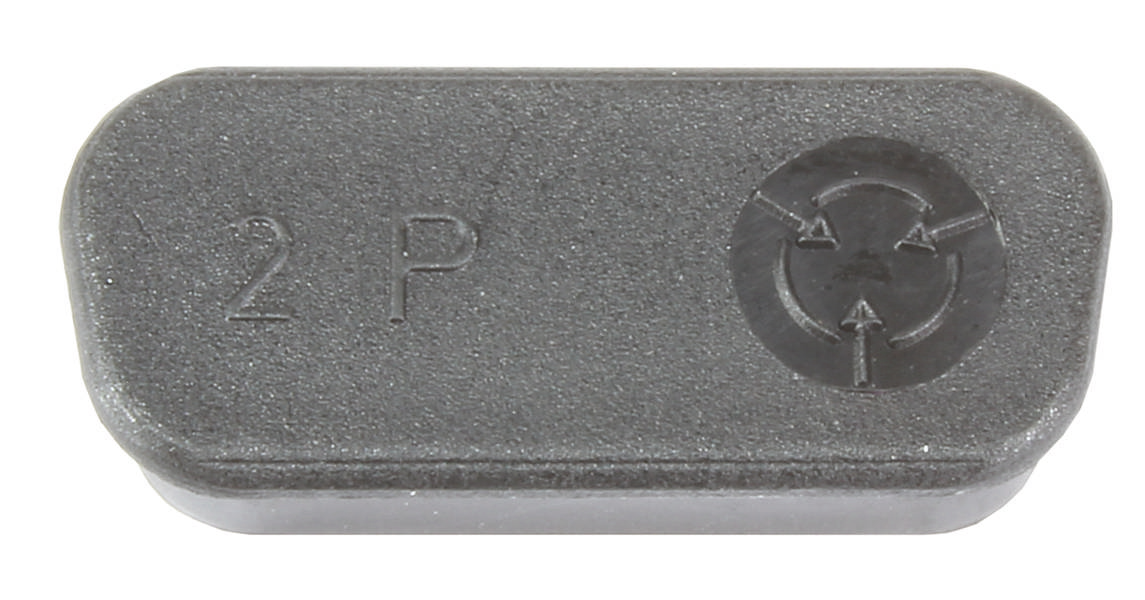 Grau-schwarzes Plastikteil mit Aufschrift '2P' und Markierungen auf der rechten Seite, möglicherweise ein mechanisches Bauteil.
