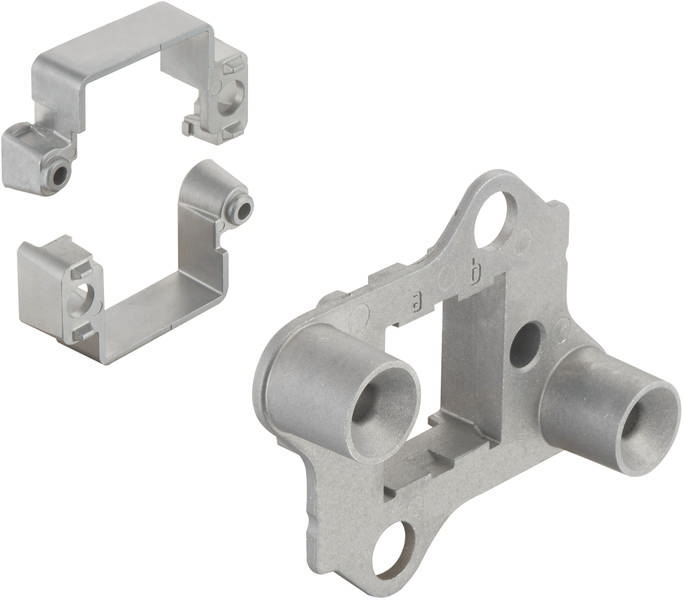 Metallhalterung mit zwei Anschlussstellen und rechteckiger Befestigung. Separates, passendes Halteelement oben links.