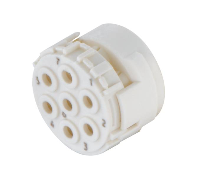 Ein weißer, runder Steckeradapter mit sieben Löchern, nummeriert von 1 bis 7, in einem symmetrischen Muster angezeigt.