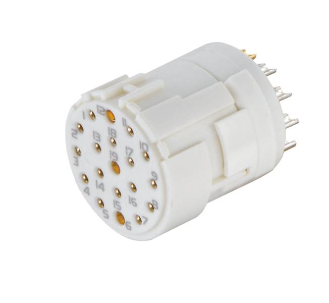 Ein runder, weißer elektrischer Stecker mit mehreren Metallstiften und nummerierten Kontakten für die Verbindung von Geräten.