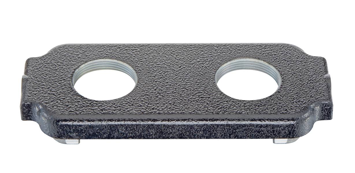 Metallplatte mit zwei kreisförmigen Öffnungen und geriffelter Oberfläche, wahrscheinlich ein Teil eines technischen Geräts oder einer Befestigung.