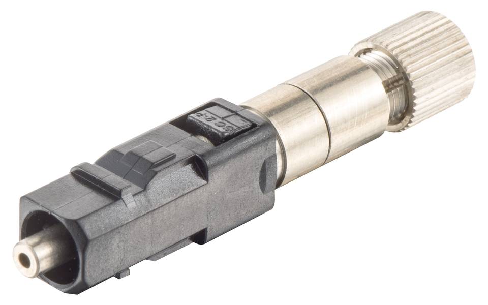 Ein rechteckiger Metall- und Kunststoffstecker mit einem gerippten Ende und einer kleinen Öffnung vorne, vermutlich für technische Anwendungen.