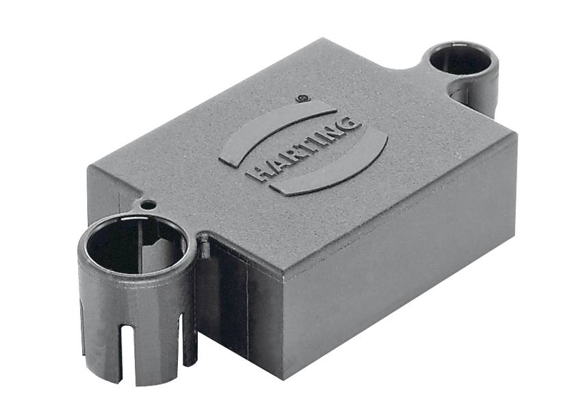 Ein grauer elektrischer Steckverbinder mit der Aufschrift 'HARTING' auf der Oberseite, geeignet für industrielle Anwendungen.