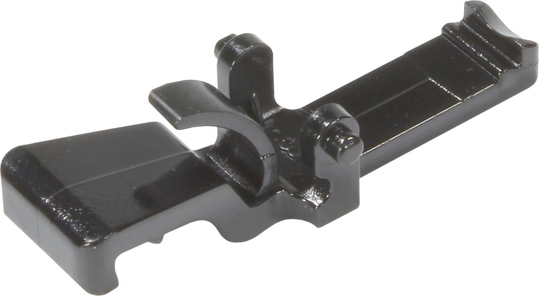 Ein schwarzes, metallisches Werkzeug oder Bauteil mit einer flachen Basis und gebogenen Elementen, möglicherweise Teil eines Mechanismus.