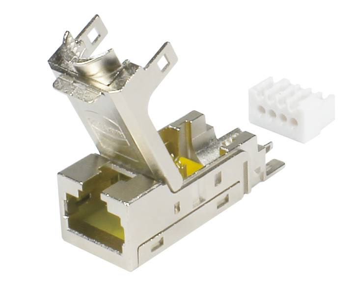 Ein Metallstecker mit offenem Deckel zur Verbindung elektronischer Komponenten. Daneben ein kleines, weißes Kunststoffteil mit fünf Löchern.