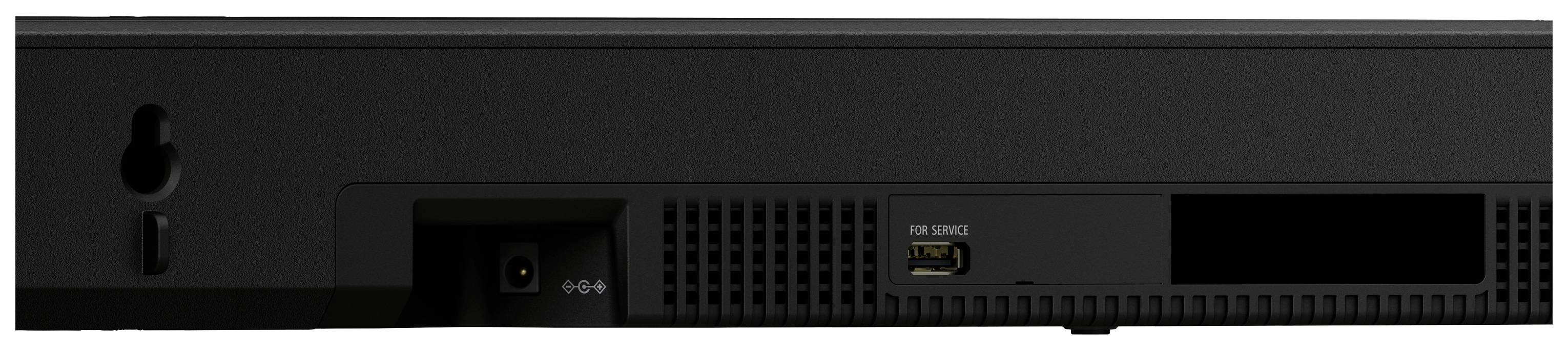 Rückseite eines elektronischen Geräts mit Stromanschluss, Lüftungsschlitzen und USB-Anschluss.