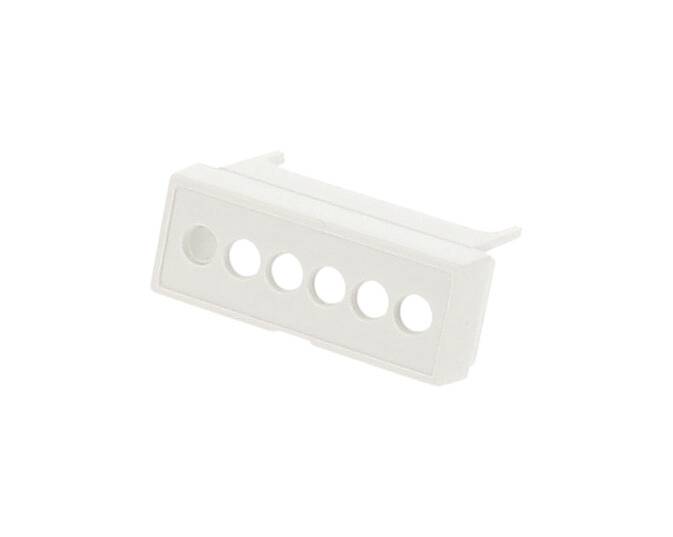 Weiße Kunststoffabdeckung mit sechs runden Löchern, möglicherweise für Schalter oder Knöpfe.