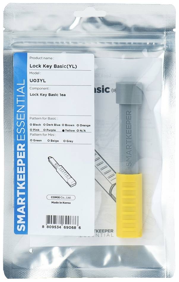 'SmartKeeper Essential Lock Key Basic(YL)' Produktverpackung mit gelbem Schlüsselschutz. Enthält Details zu Modell und Komponenten.