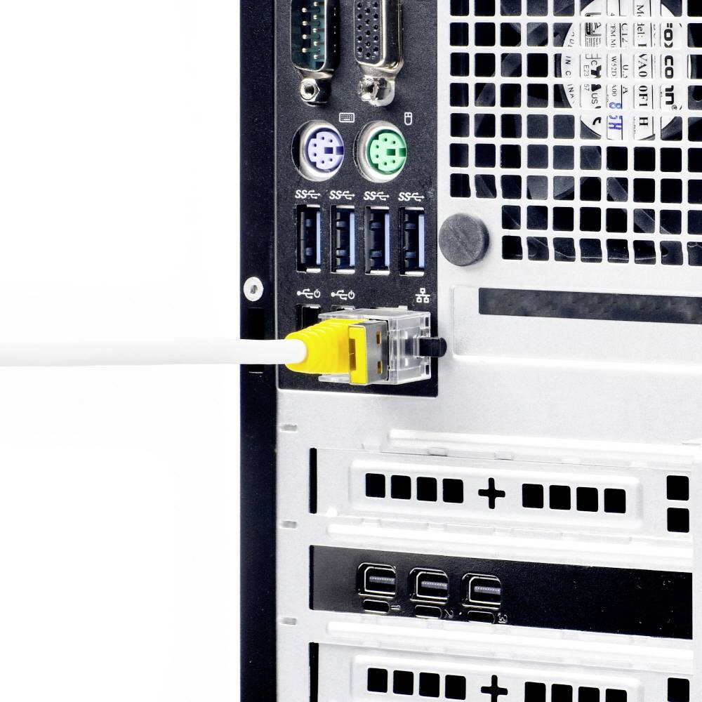 Die Rückseite eines Computers zeigt verschiedene Anschlüsse. Ein gelbes Ethernet-Kabel ist eingesteckt. Vier USB-Anschlüsse sind sichtbar.