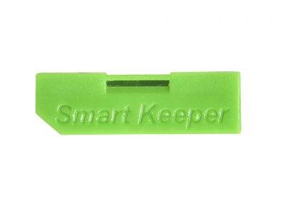 Grüner USB-Sicherheitsverschluss mit der Aufschrift 'Smart Keeper', dient zum Schutz von USB-Ports vor unbefugtem Zugriff.