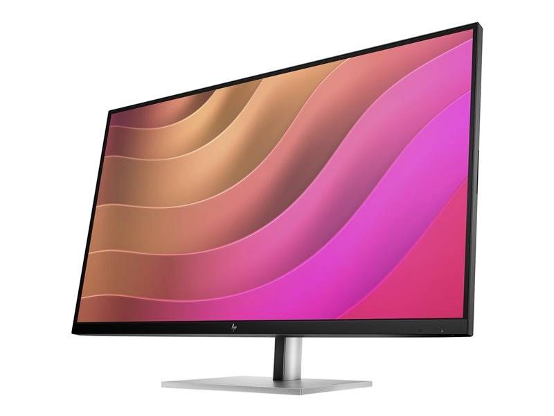 Ein moderner Computermonitor mit einem leuchtenden, wellenförmigen Hintergrund in Rot- und Pinktönen, auf einem schlanken Standfuß.