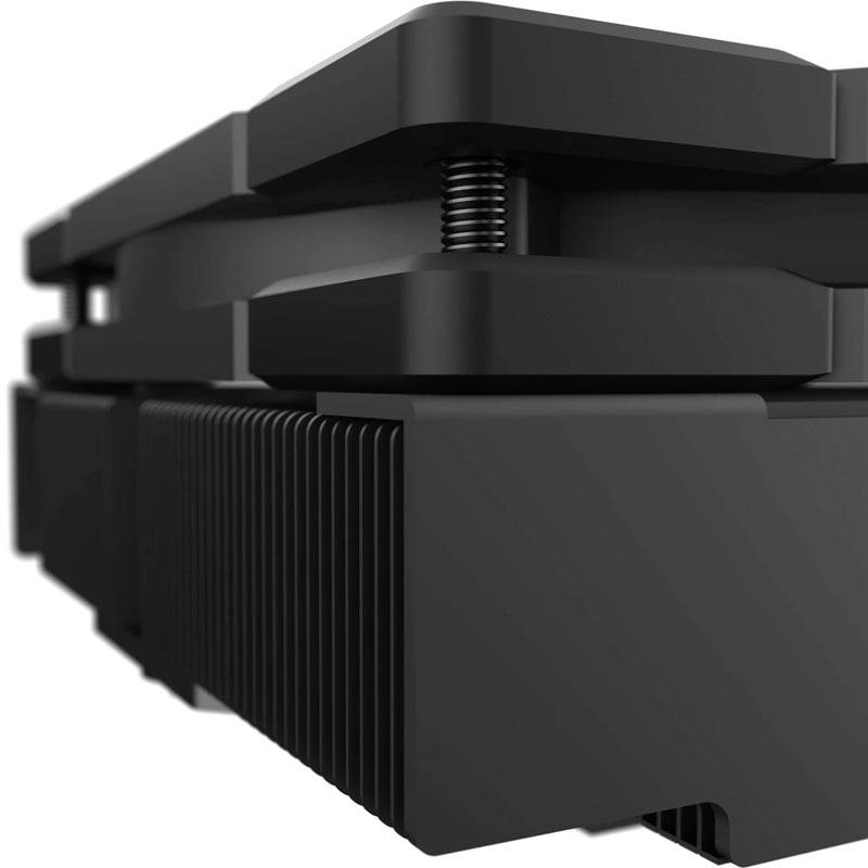 Ein schwarzes, technisches Gerät mit gestapelten Teilen und sichtbaren Federn, möglicherweise ein elektronisches Bauteil.