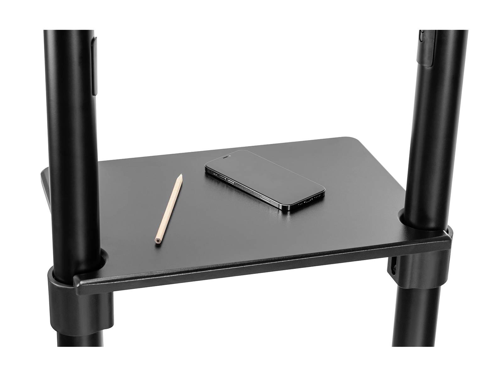 Ein Stift und ein schwarzes Smartphone liegen auf einem schwarzen kleinen Tisch, der von zwei schwarzen Säulen gestützt wird.