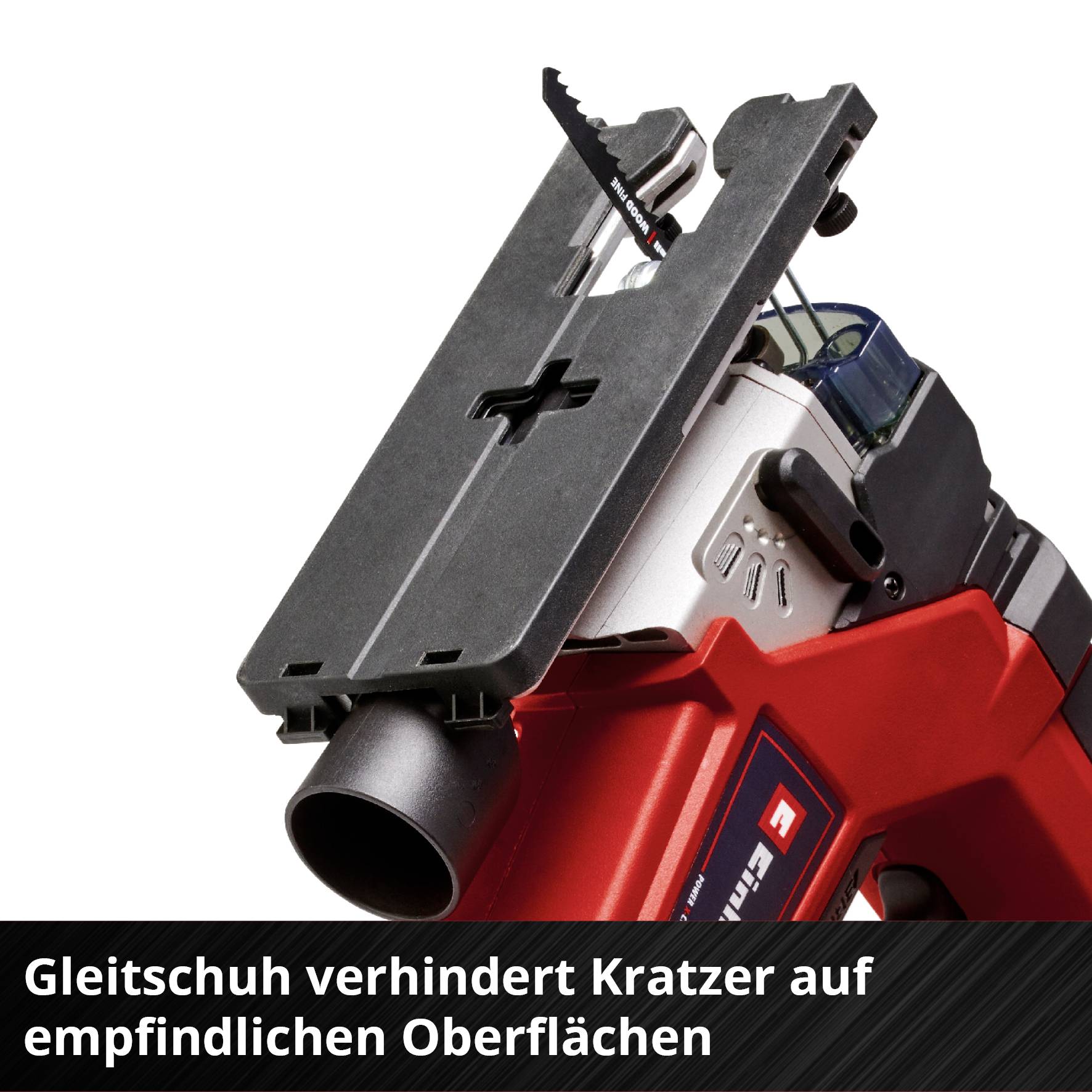 Eine rote Säge mit einem schwarzen Gleitschuh-Aufsatz. Der Text auf der Unterseite lautet: 'Gleitschuh verhindert Kratzer auf empfindlichen Oberflächen'.