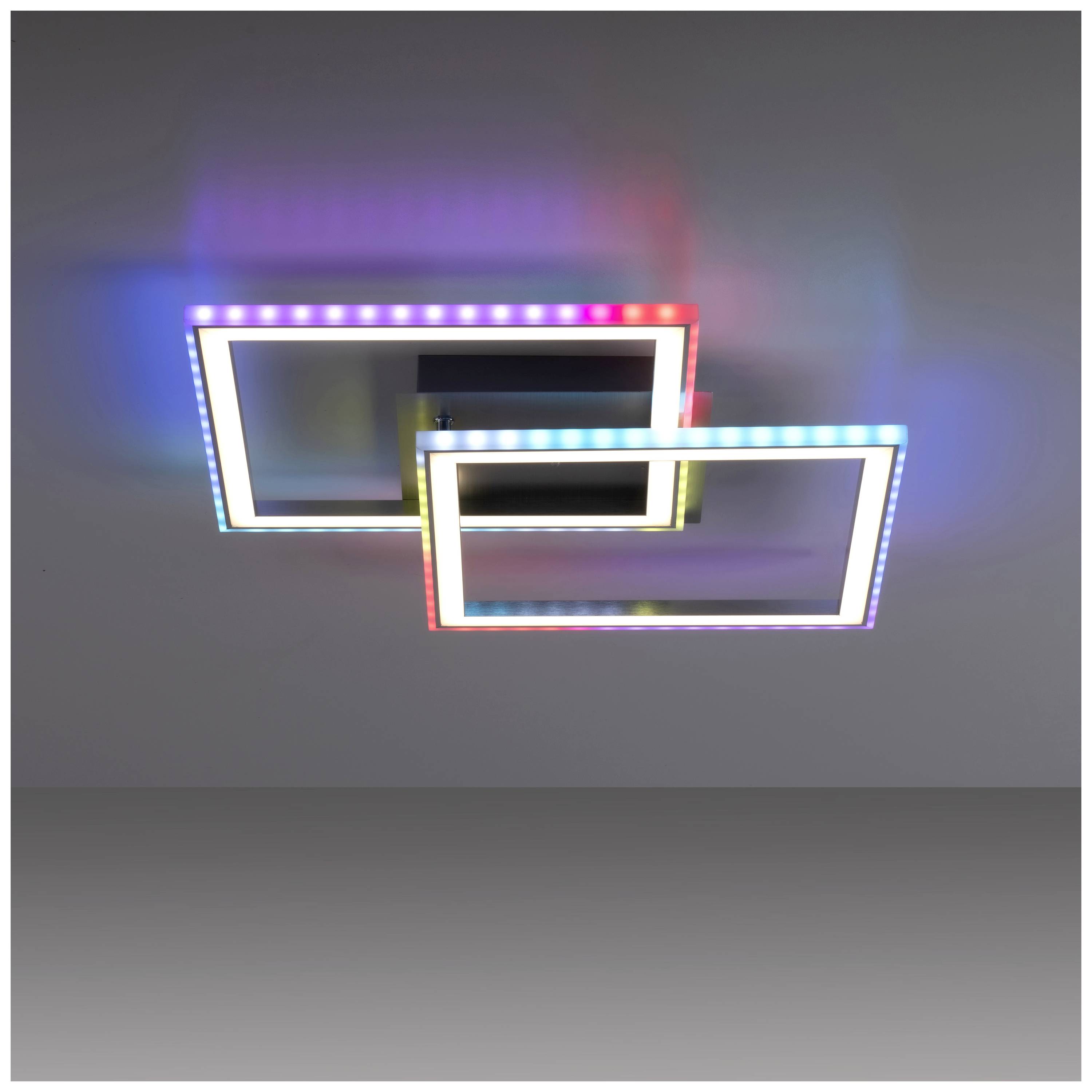 Moderne Deckenleuchte mit zwei ineinander verschachtelten Rechtecken, die in bunten Farben leuchten. Schlichte graue Hintergrundwand.