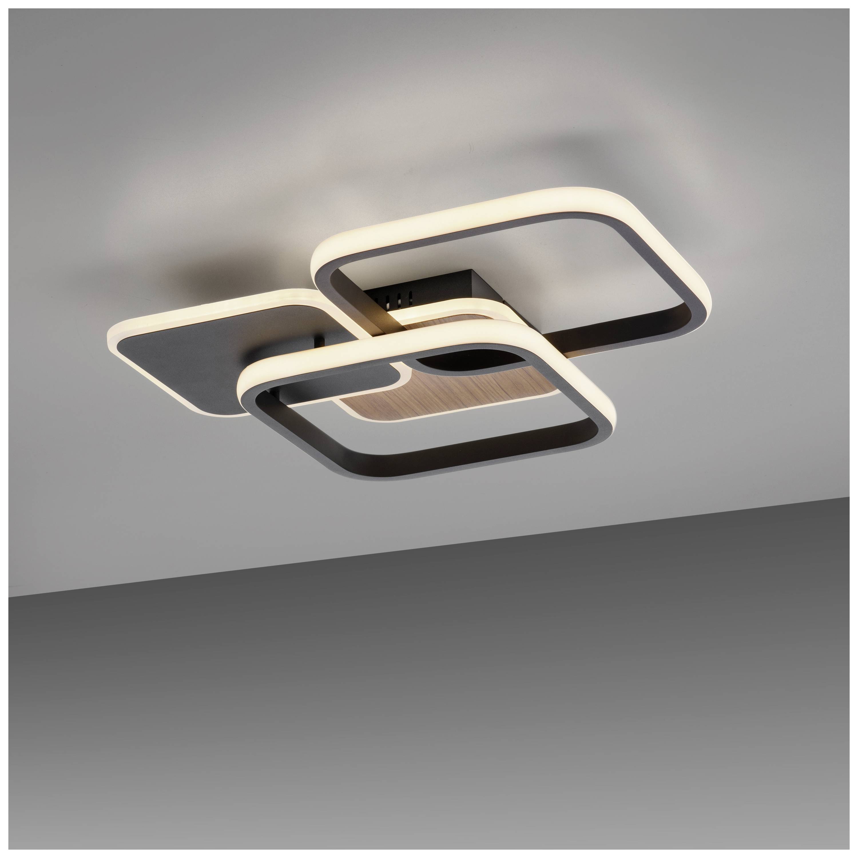 Quadratische Deckenleuchte mit modernem Design, bestehend aus versetzten, ineinander verschachtelten Rahmen und LED-Beleuchtung.