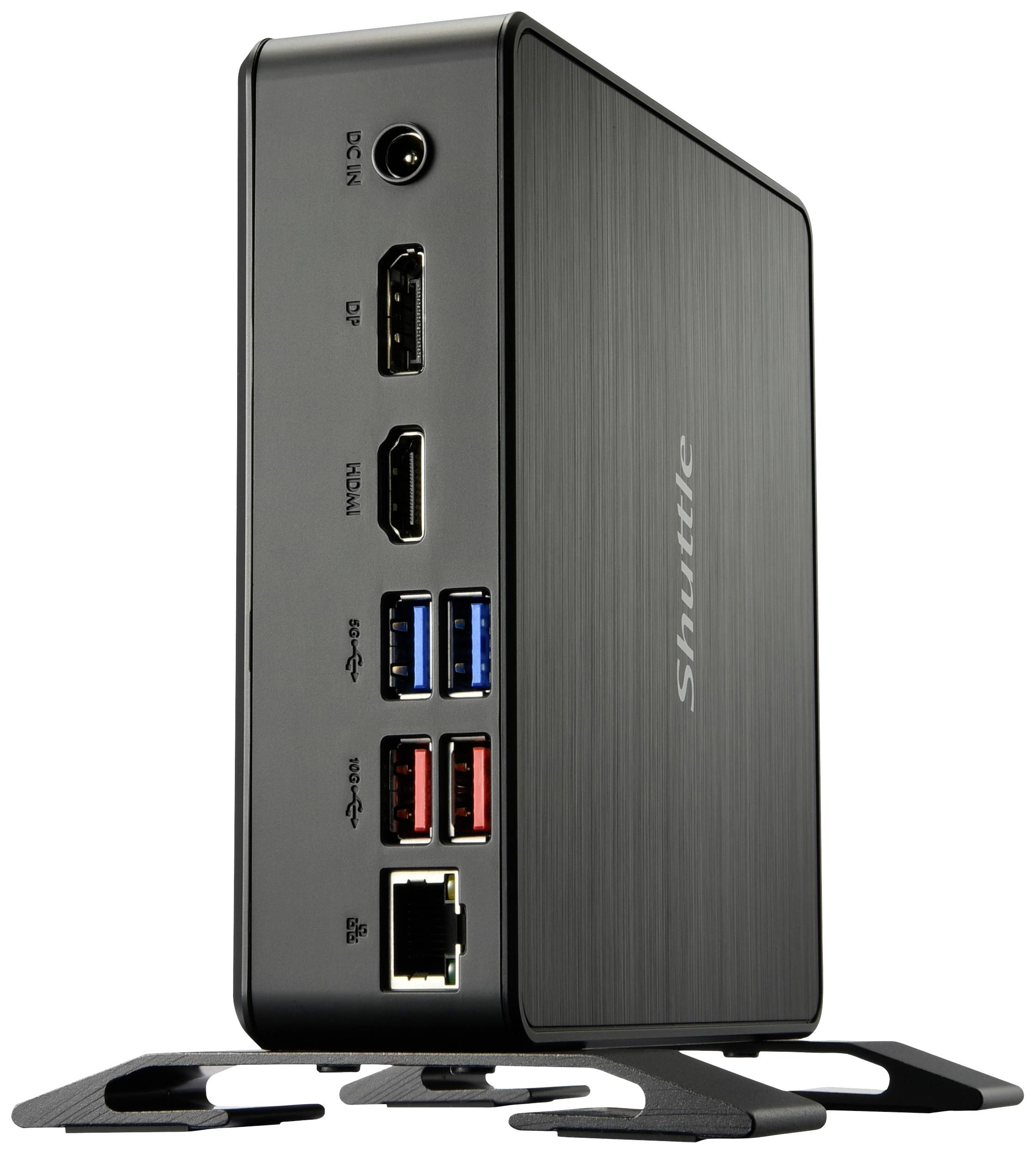 Ein schwarzer Mini-PC mit mehreren Anschlussmöglichkeiten: DP, HDMI, USB-Ports und Ethernet-Anschluss. Markenlogo 'Shuttle' seitlich sichtbar.