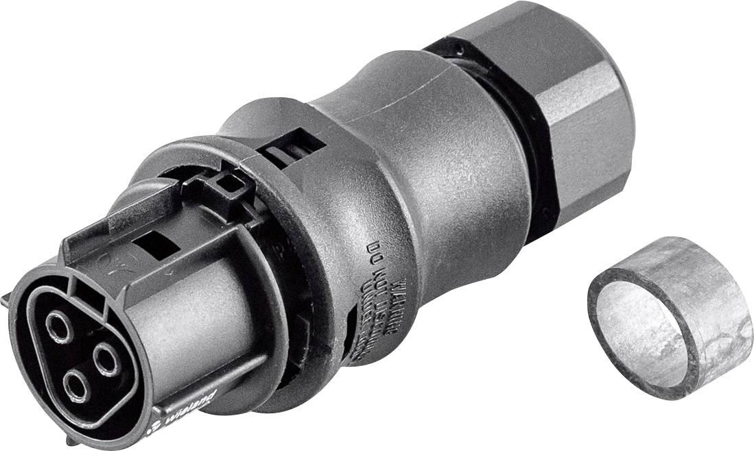 Nahaufnahme eines zylindrischen elektrischen Steckeradapters mit dreipoliger Buchse und Sechskantmutter, dargestellt neben einem kleinen Metallring auf weißem Hintergrund.