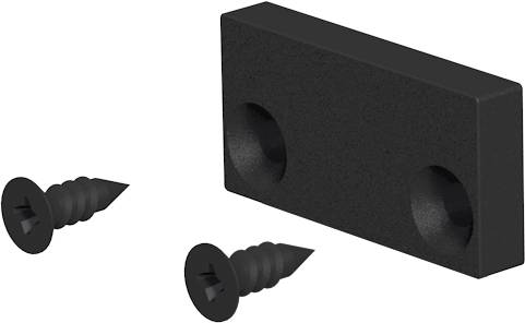 Schwarzer rechteckiger Montageklotz mit zwei versenkten Bohrungen, daneben zwei passende Schrauben auf weißem Hintergrund dargestellt.