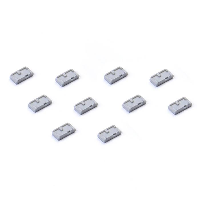 Zehn kleine, graue, rechteckige Bauteile, gleichmäßig auf weißem Hintergrund verteilt.