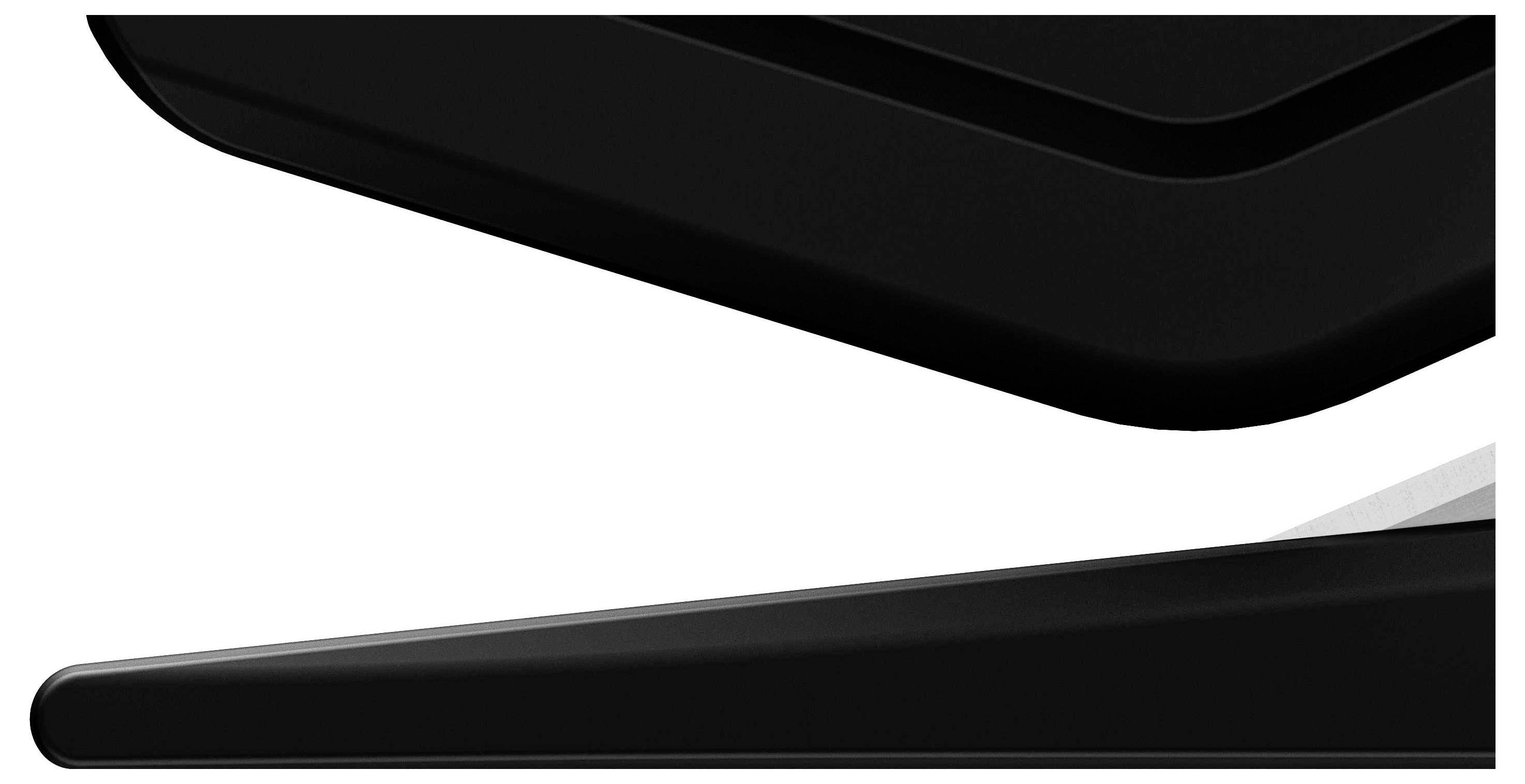 Nahaufnahme eines schwarzen, abgewinkelten Objekts auf weißem Hintergrund. Design oder Form unklar, Fokus auf Textur und Kanten.