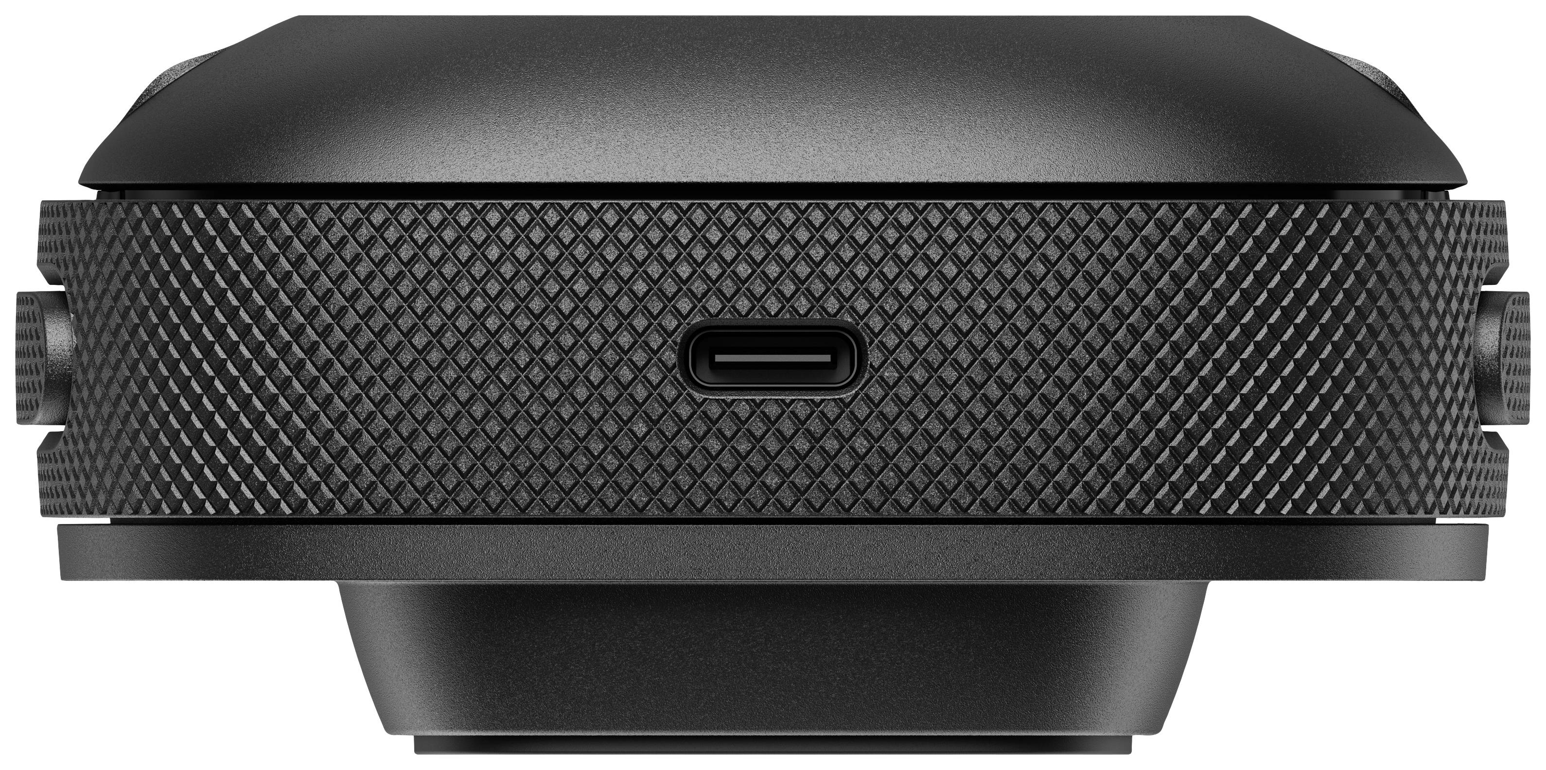 Eine schwarze, runde elektronische Geräteseite mit USB-C-Anschluss und gezackter Textur.