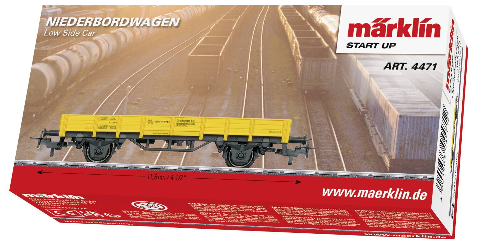 Verpackung eines Märklin Niederbordwagens, Art.-Nr. 4471, mit gelbem Waggonmodell, umgeben von einem Güterzugbahnhofmotiv.
