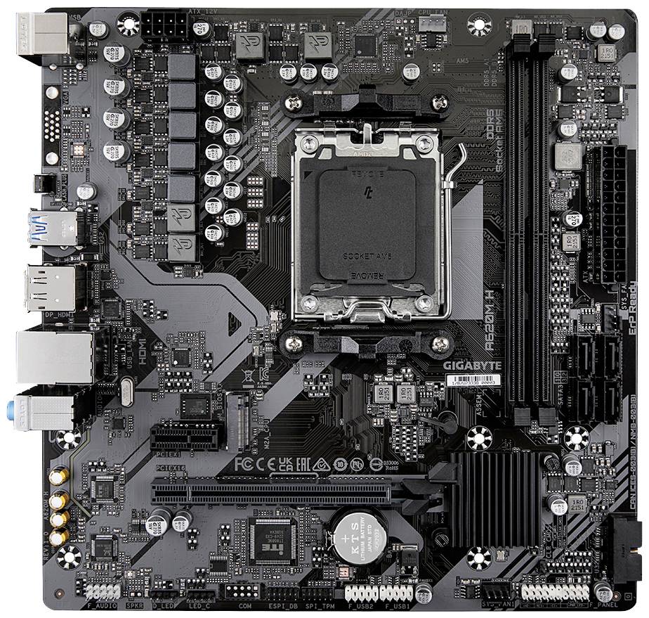 Eine schwarze Computer-Motherboard-Platine mit verschiedenen Anschlüssen und Chips, darunter ein CPU-Sockel in der Mitte.