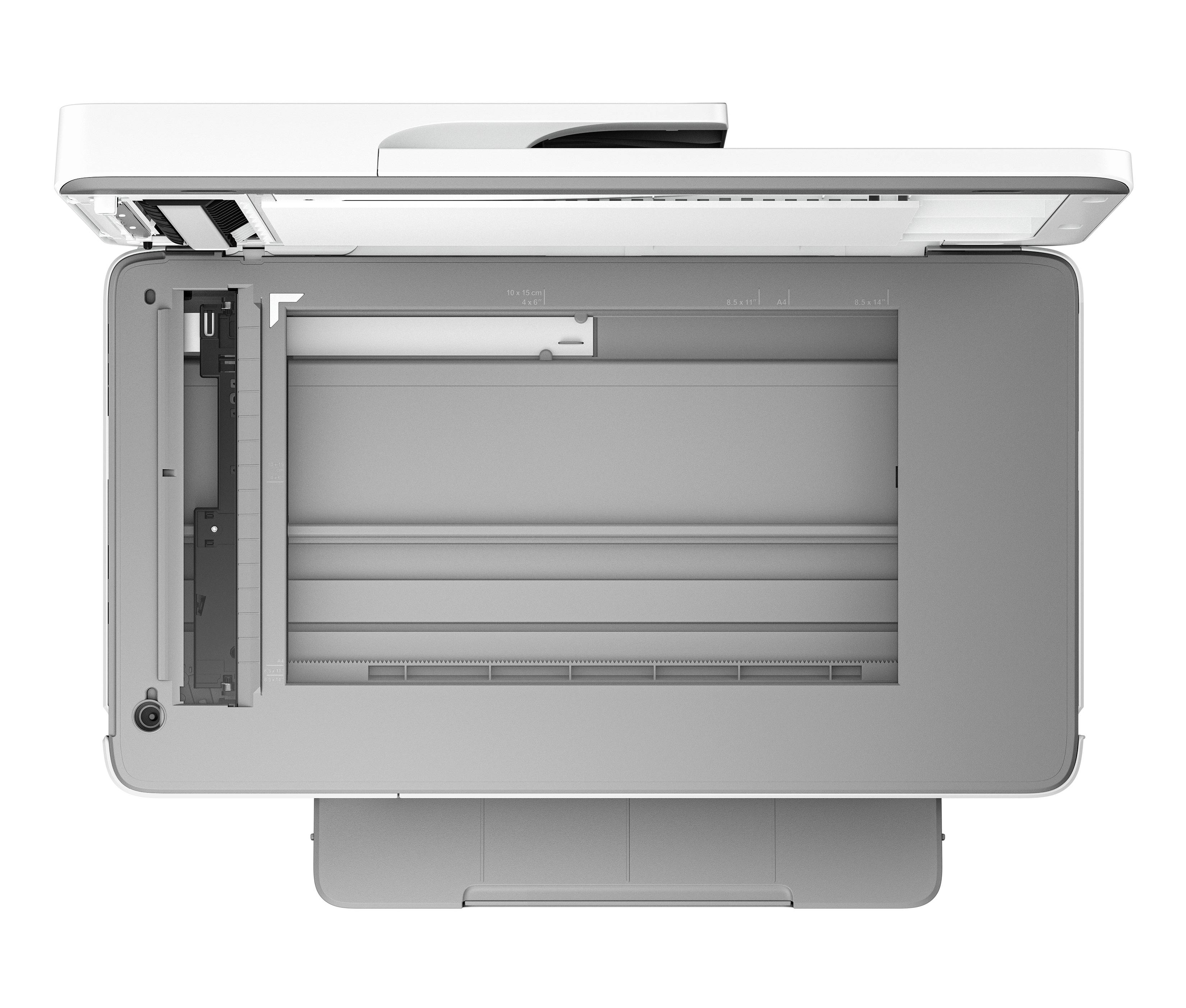 Draufsicht auf einen geöffneten Kopierer oder Multifunktionsdrucker, sichtbar ist die Scannerfläche und Papierzuführung.