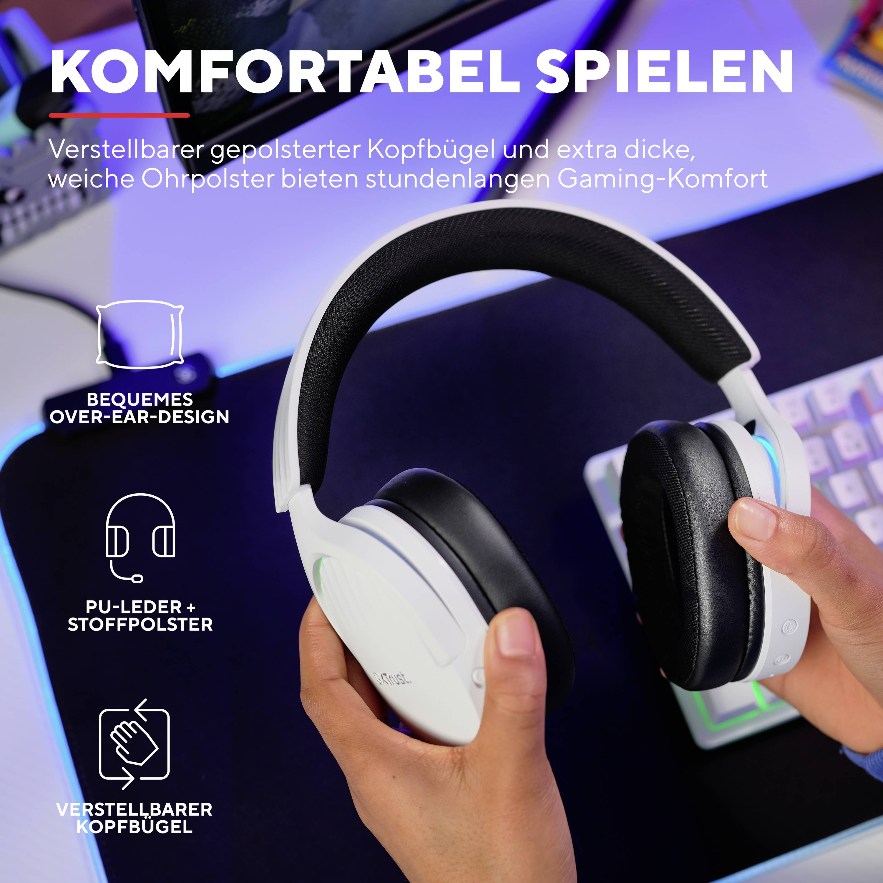 Gaming-Headset mit verstellbarem, gepolstertem Kopfbügel und dicken Ohrpolstern für langen Komfort. Schwebend über Schreibtisch mit bunter Tastatur.