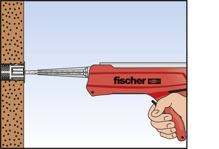 Eine Hand hält ein rotes Werkzeug mit der Aufschrift 'fischer', das Dübel in eine Betonwand setzt.