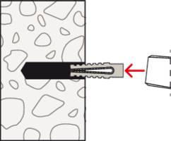 Diagramm zeigt einen Dübel, der in eine Bohrung in einer Wand aus unregelmäßigem Material eingesetzt wird. Ein Pfeil weist auf den Dübel.