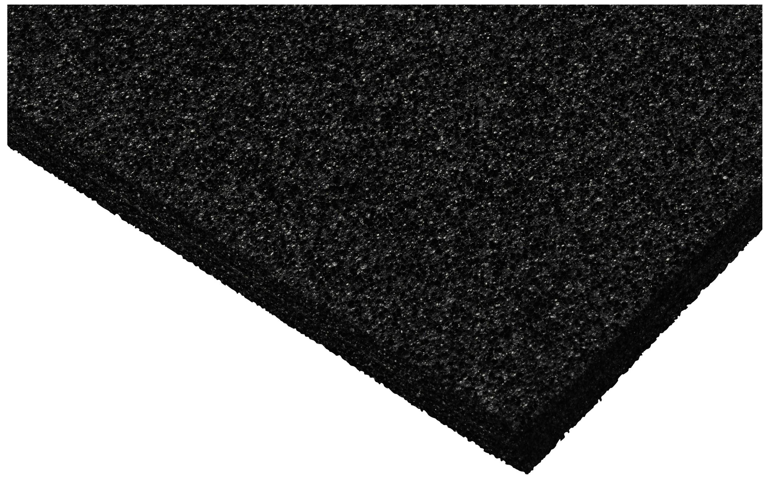 Eine schwarze, rechteckige Gummimatte mit strukturierter Oberfläche, leicht schräg fotografiert.