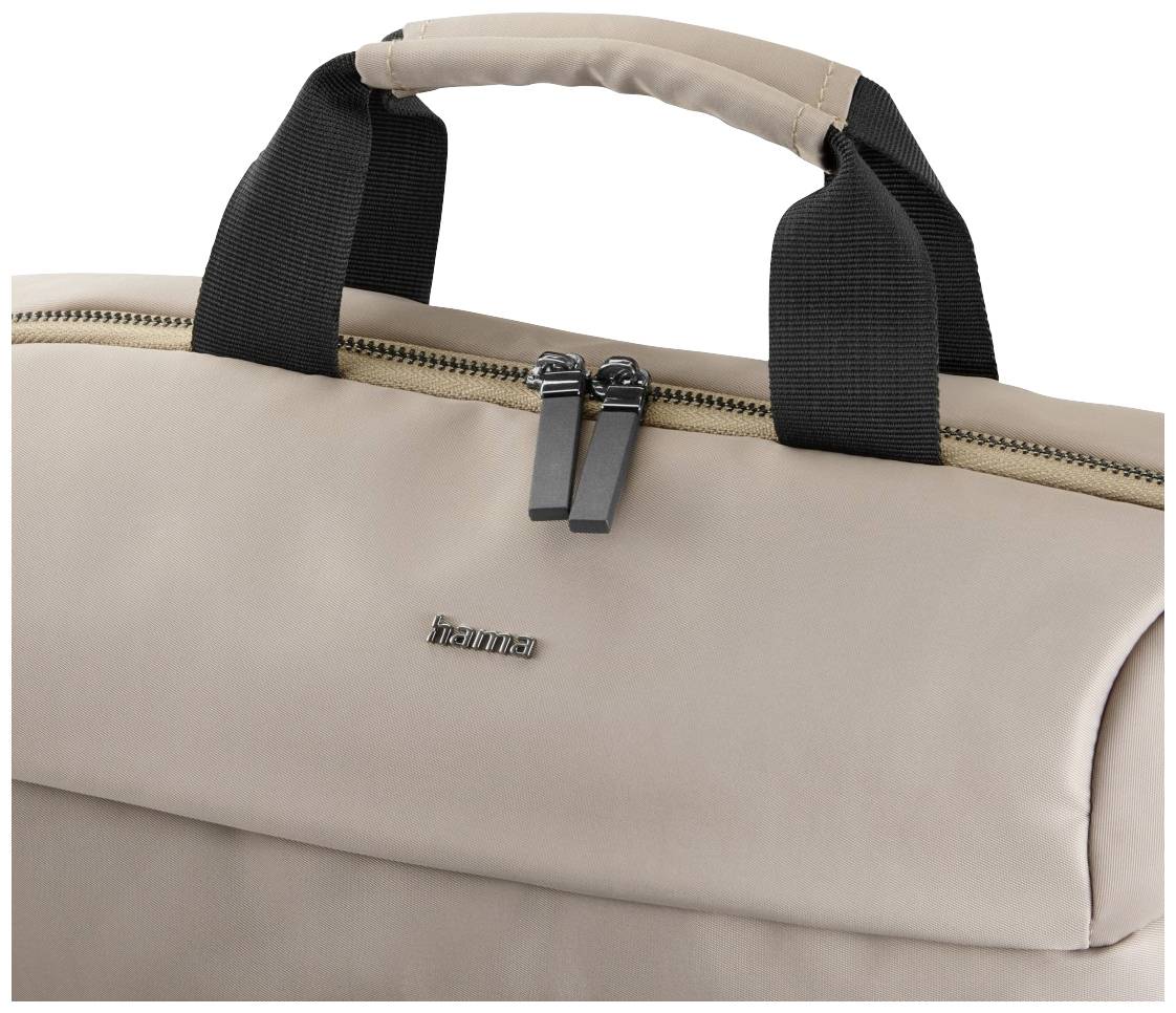 Beige Tasche mit schwarzen Griffen und Reißverschluss, Marke 'hama' auf der Vorderseite sichtbar.