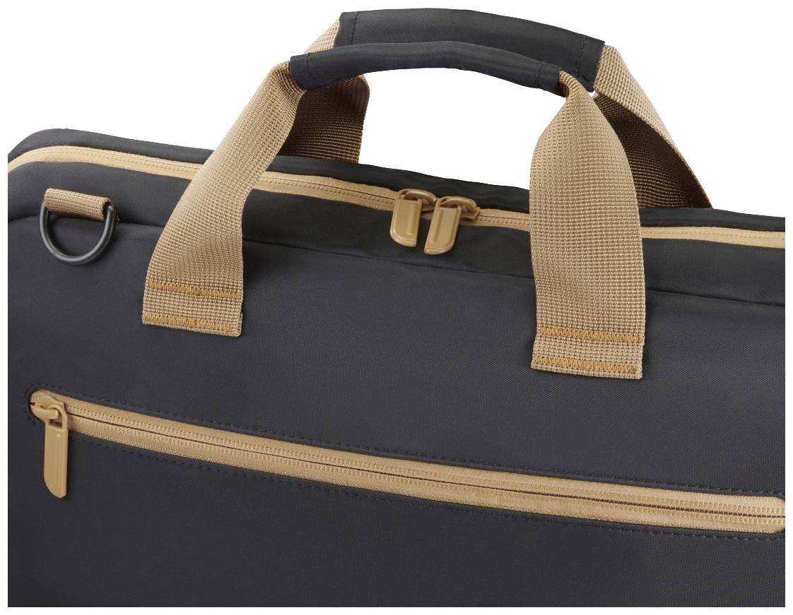 Eine schwarze Tasche mit braunen Griffen und Reißverschlüssen. Oberer Teil und Detail des Verschlusses sichtbar.