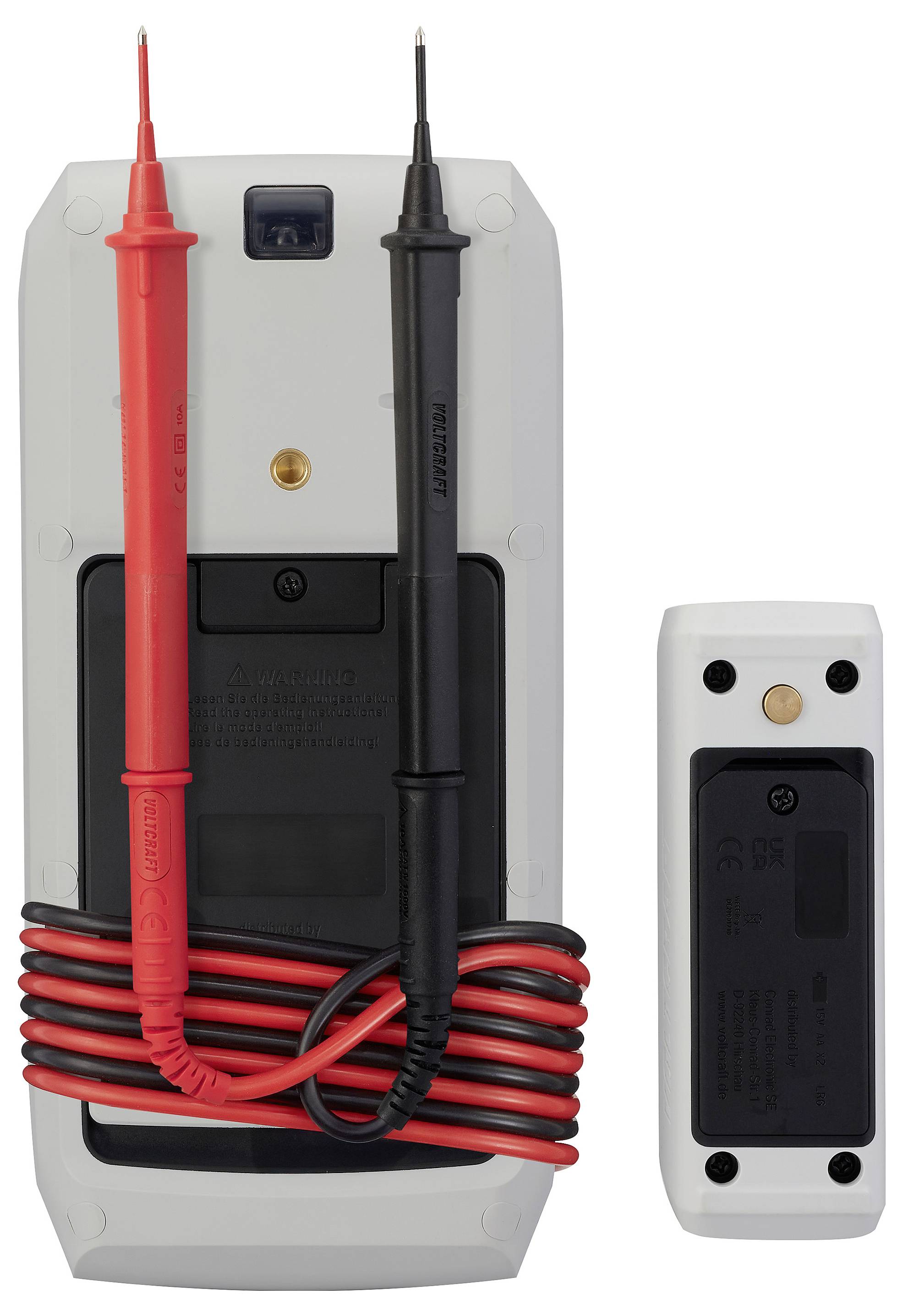 Digitales Multimeter mit angeschlossenen roten und schwarzen Messspitzen sowie einem kleinen abnehmbaren Sensormodul daneben auf weißem Hintergrund.
