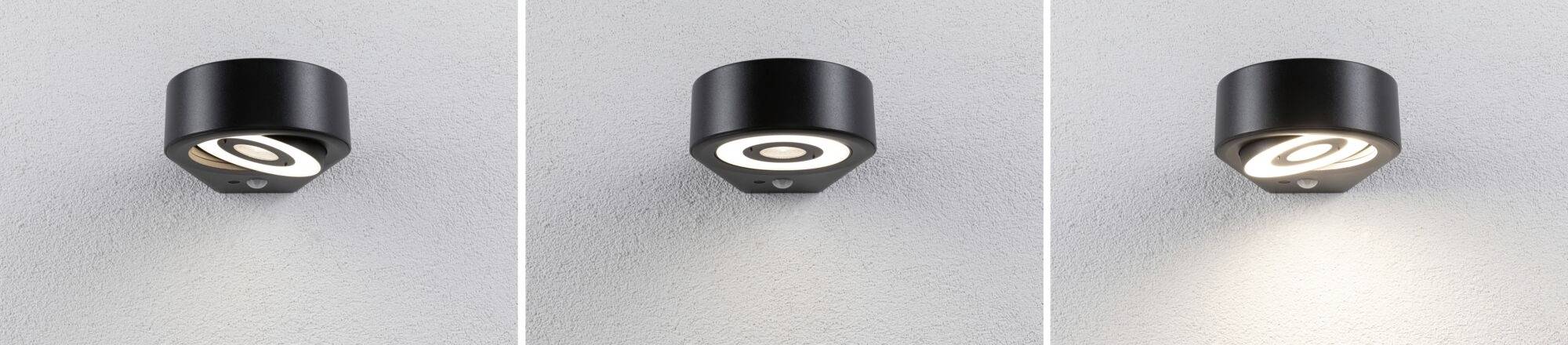 Drei Deckenspots, die unterschiedliche Lichtintensitäten beleuchten. Jeder Spot erzeugt eine andere Helligkeit auf der grauen Wand.