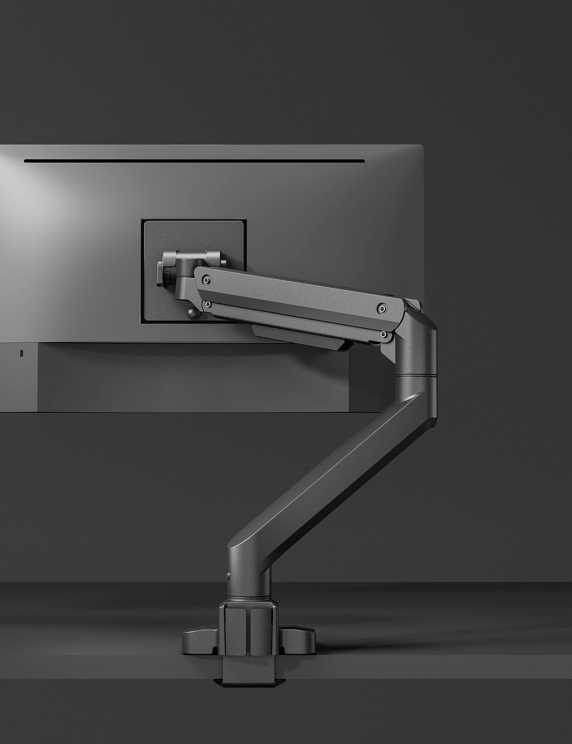 Ein schwarzer Monitorarm hält einen Bildschirm, montiert auf einem Schreibtisch. Der Arm ist verstellbar und modern gestaltet.